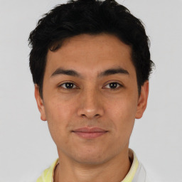 Joyful asian young-adult male with short  black hair and brown eyes