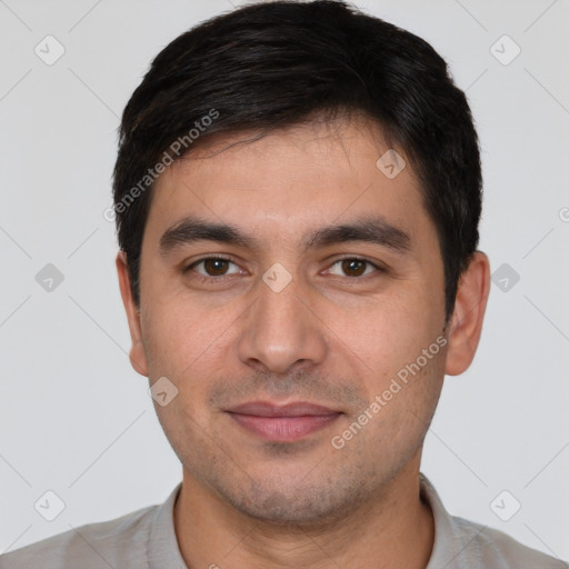 Joyful white young-adult male with short  black hair and brown eyes