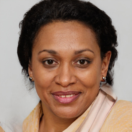 Joyful latino adult female with short  brown hair and brown eyes