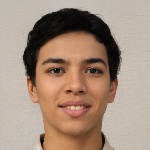 Joyful asian young-adult male with short  black hair and brown eyes