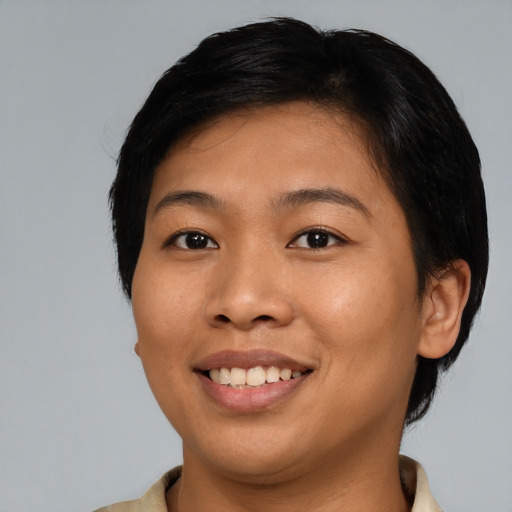 Joyful asian young-adult female with medium  black hair and brown eyes