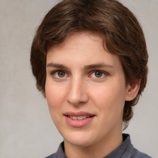 Joyful white young-adult female with medium  brown hair and grey eyes