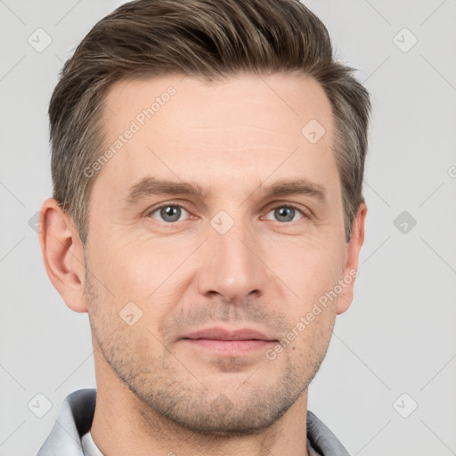 Joyful white adult male with short  brown hair and grey eyes