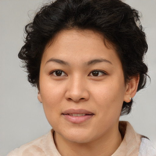 Joyful asian young-adult female with medium  brown hair and brown eyes