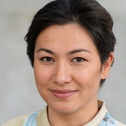 Joyful white adult female with short  brown hair and brown eyes