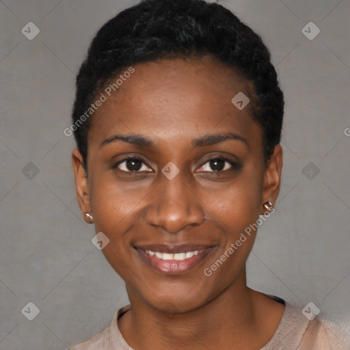 Joyful black young-adult female with short  black hair and brown eyes