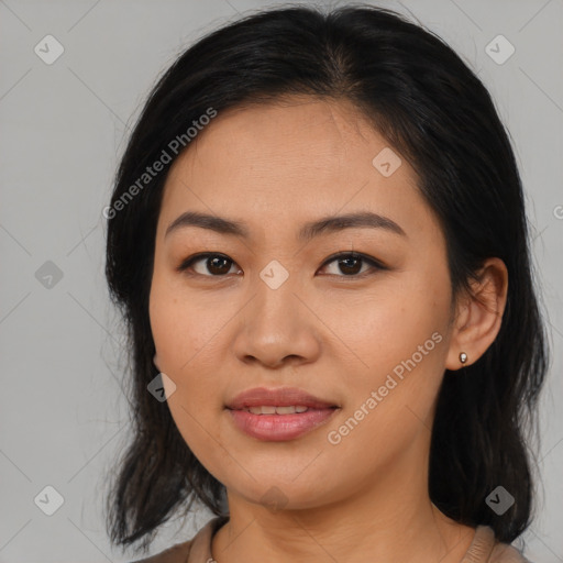 Joyful asian young-adult female with medium  black hair and brown eyes