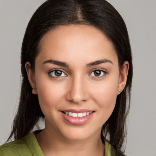 Joyful white young-adult female with medium  brown hair and brown eyes