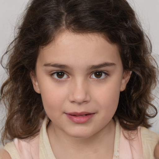 Joyful white child female with medium  brown hair and brown eyes