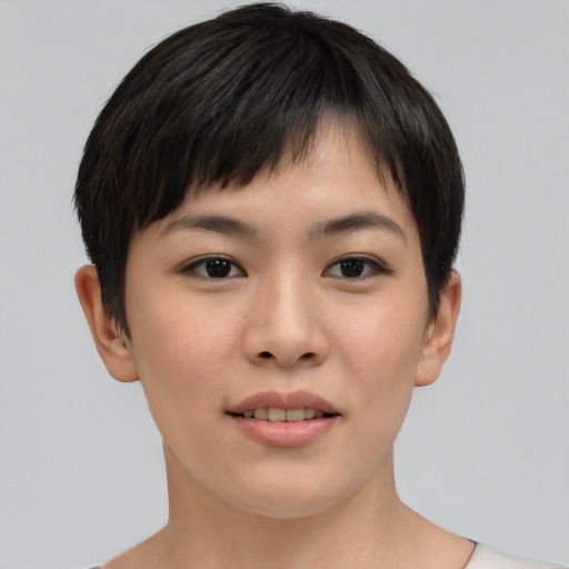 Joyful asian young-adult female with short  brown hair and brown eyes