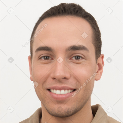 Joyful white young-adult male with short  brown hair and brown eyes