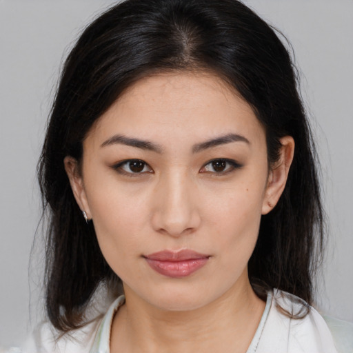 Neutral asian young-adult female with medium  brown hair and brown eyes