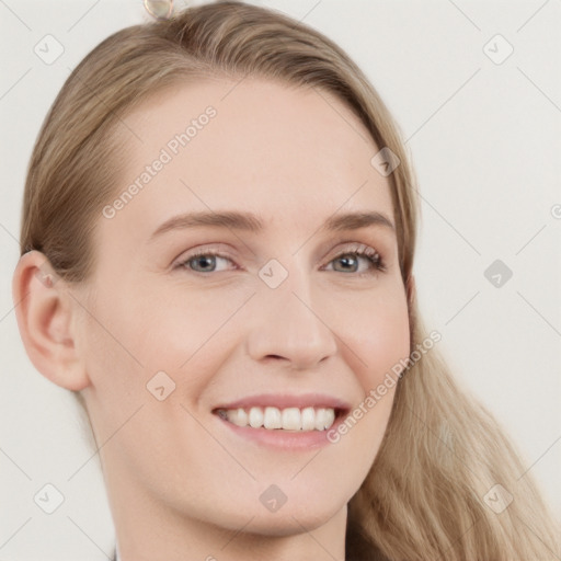 Joyful white young-adult female with long  brown hair and grey eyes