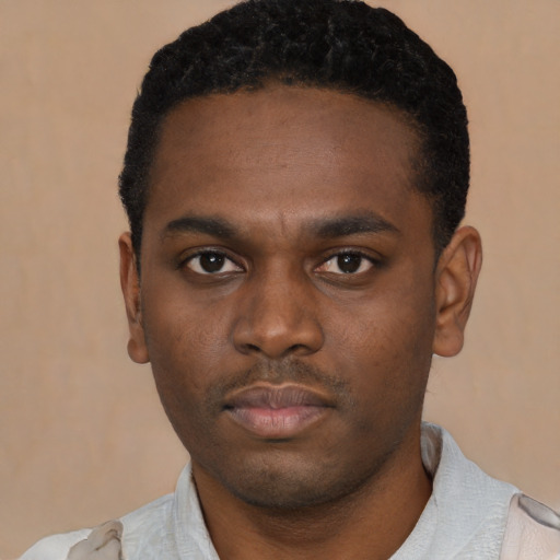Neutral black young-adult male with short  black hair and brown eyes