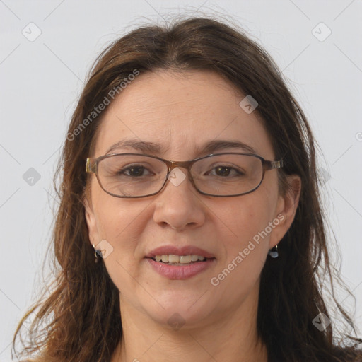 Joyful white adult female with long  brown hair and grey eyes