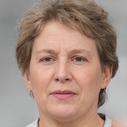 Joyful white middle-aged female with short  brown hair and brown eyes