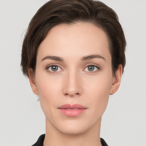 Neutral white young-adult female with short  brown hair and brown eyes