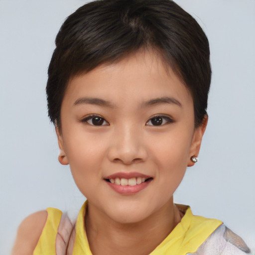 Joyful asian child female with short  brown hair and brown eyes