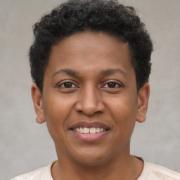 Joyful latino young-adult male with short  brown hair and brown eyes