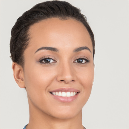 Joyful white young-adult female with short  brown hair and brown eyes