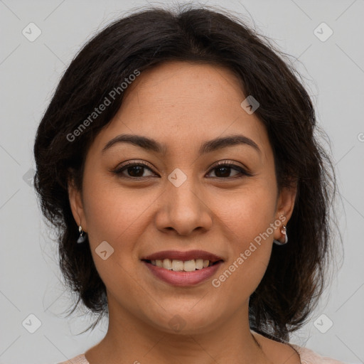 Joyful latino young-adult female with medium  brown hair and brown eyes