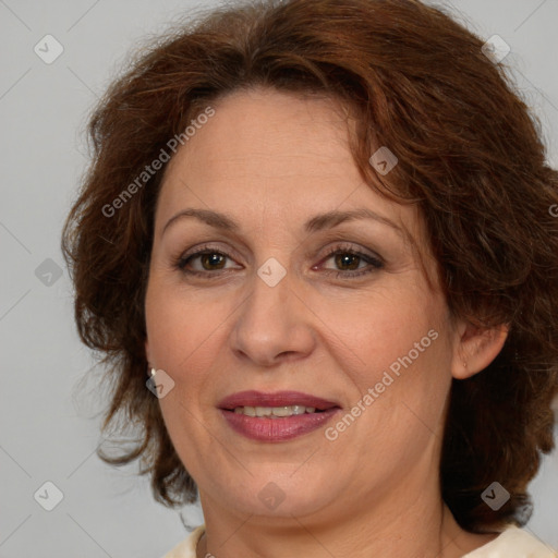 Joyful white adult female with medium  brown hair and brown eyes