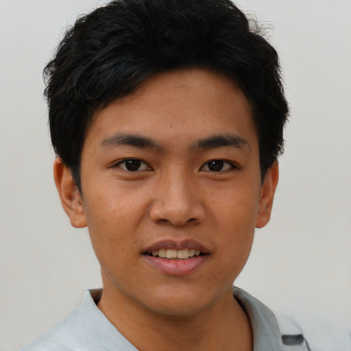 Joyful asian young-adult male with short  black hair and brown eyes