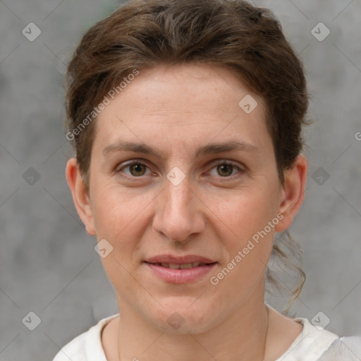 Joyful white adult female with short  brown hair and grey eyes