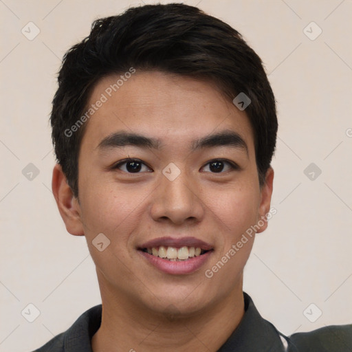 Joyful asian young-adult male with short  black hair and brown eyes