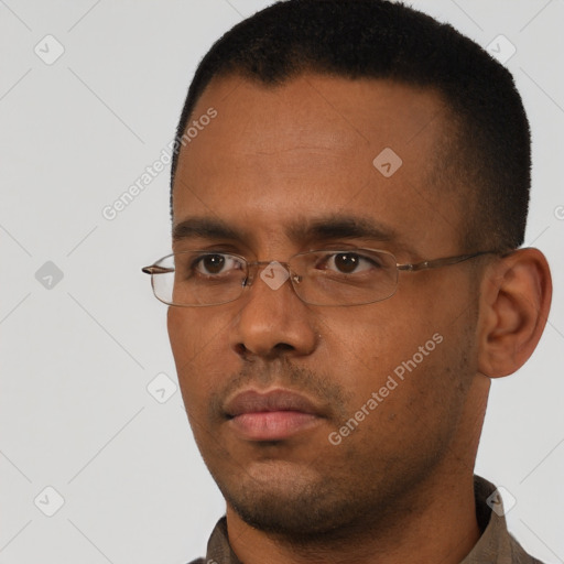 Neutral black young-adult male with short  black hair and brown eyes