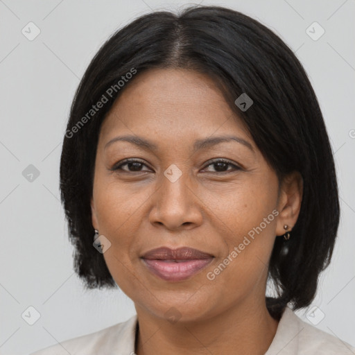 Joyful black adult female with medium  brown hair and brown eyes