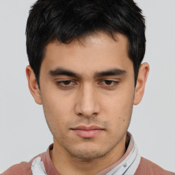 Neutral asian young-adult male with short  brown hair and brown eyes