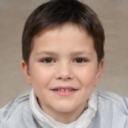 Joyful white child male with short  brown hair and brown eyes