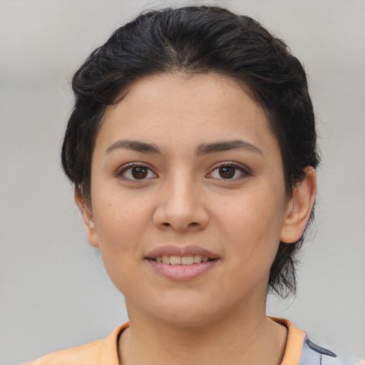Joyful asian young-adult female with medium  brown hair and brown eyes