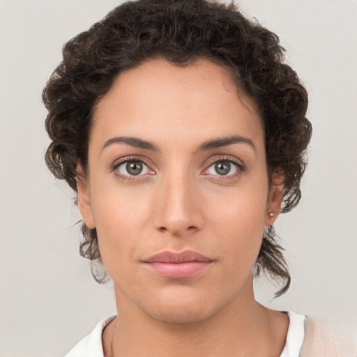 Neutral white young-adult female with short  brown hair and brown eyes