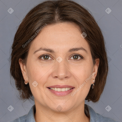 Joyful white adult female with medium  brown hair and brown eyes