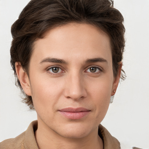 Joyful white young-adult female with short  brown hair and grey eyes