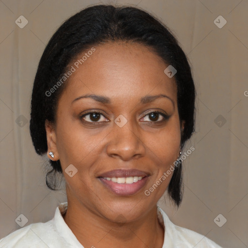 Joyful black adult female with medium  brown hair and brown eyes