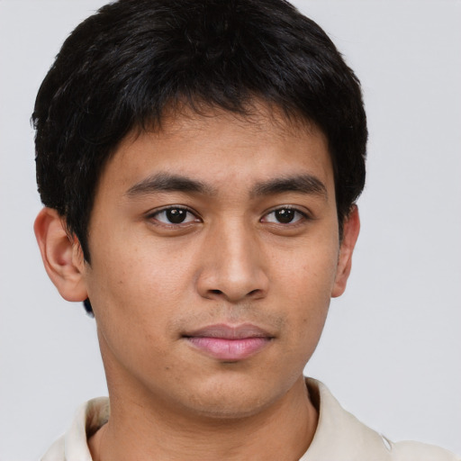 Joyful asian young-adult male with short  brown hair and brown eyes