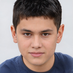 Joyful white child male with short  brown hair and brown eyes