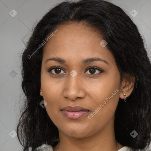 Joyful black young-adult female with long  brown hair and brown eyes