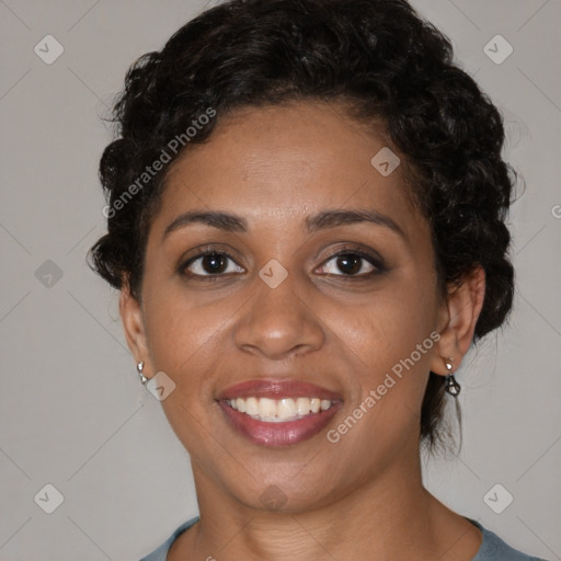 Joyful black young-adult female with medium  brown hair and brown eyes