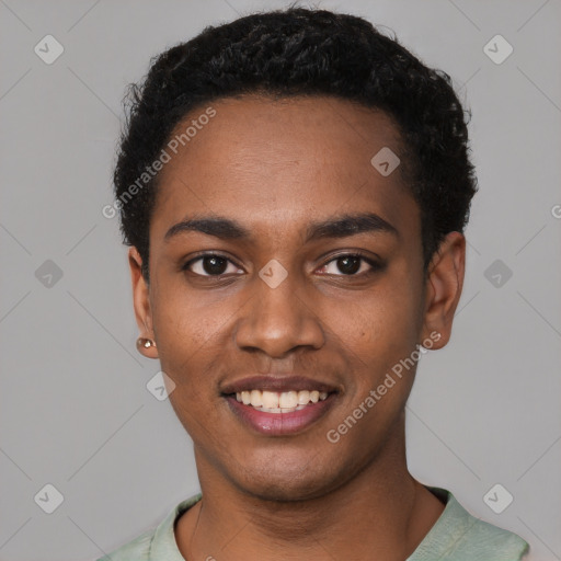 Joyful black young-adult male with short  black hair and brown eyes