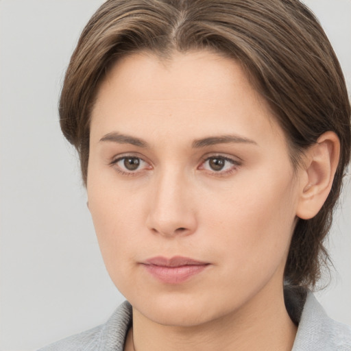 Neutral white young-adult female with medium  brown hair and brown eyes