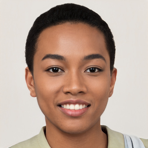 Joyful latino young-adult female with short  black hair and brown eyes