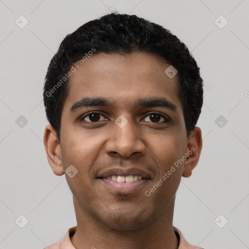 Joyful latino young-adult male with short  black hair and brown eyes