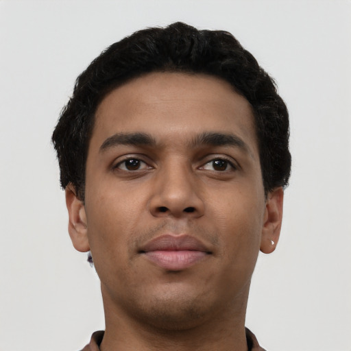 Neutral latino young-adult male with short  brown hair and brown eyes