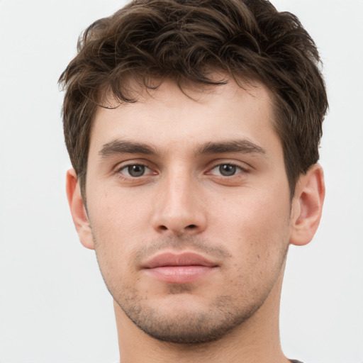 Neutral white young-adult male with short  brown hair and brown eyes