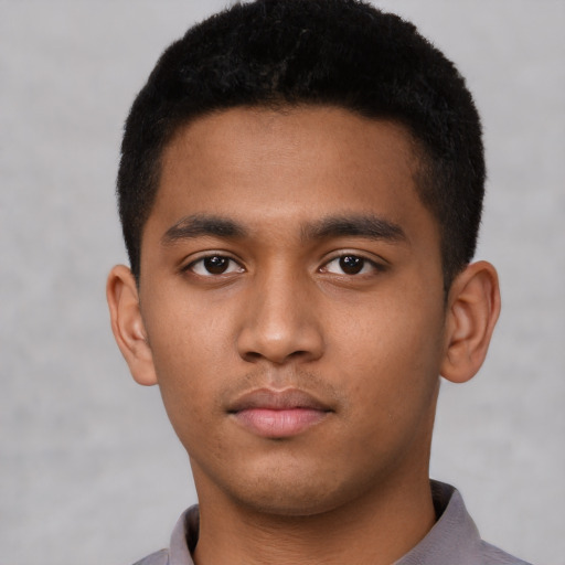 Neutral latino young-adult male with short  brown hair and brown eyes