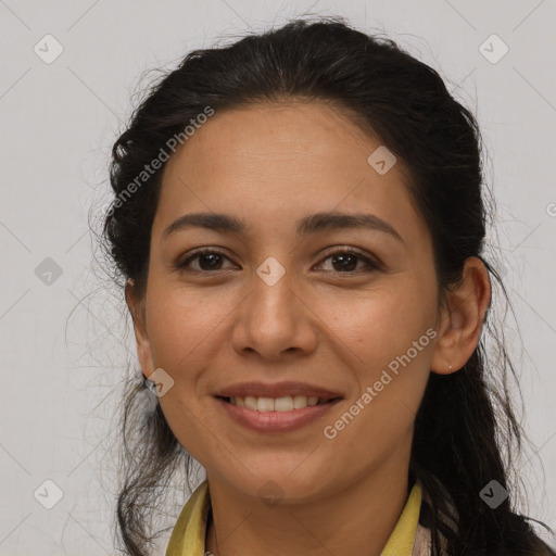 Joyful latino young-adult female with long  brown hair and brown eyes